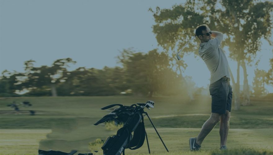 A man is playing golf on the course